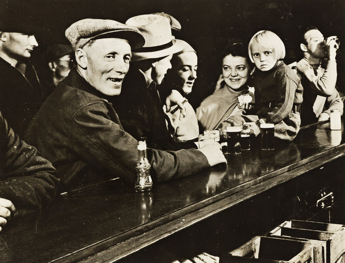 MARGARET BOURKE-WHITE (1904-1971) Scene at a dam-workers’ bar, Fort Peck, Montana.